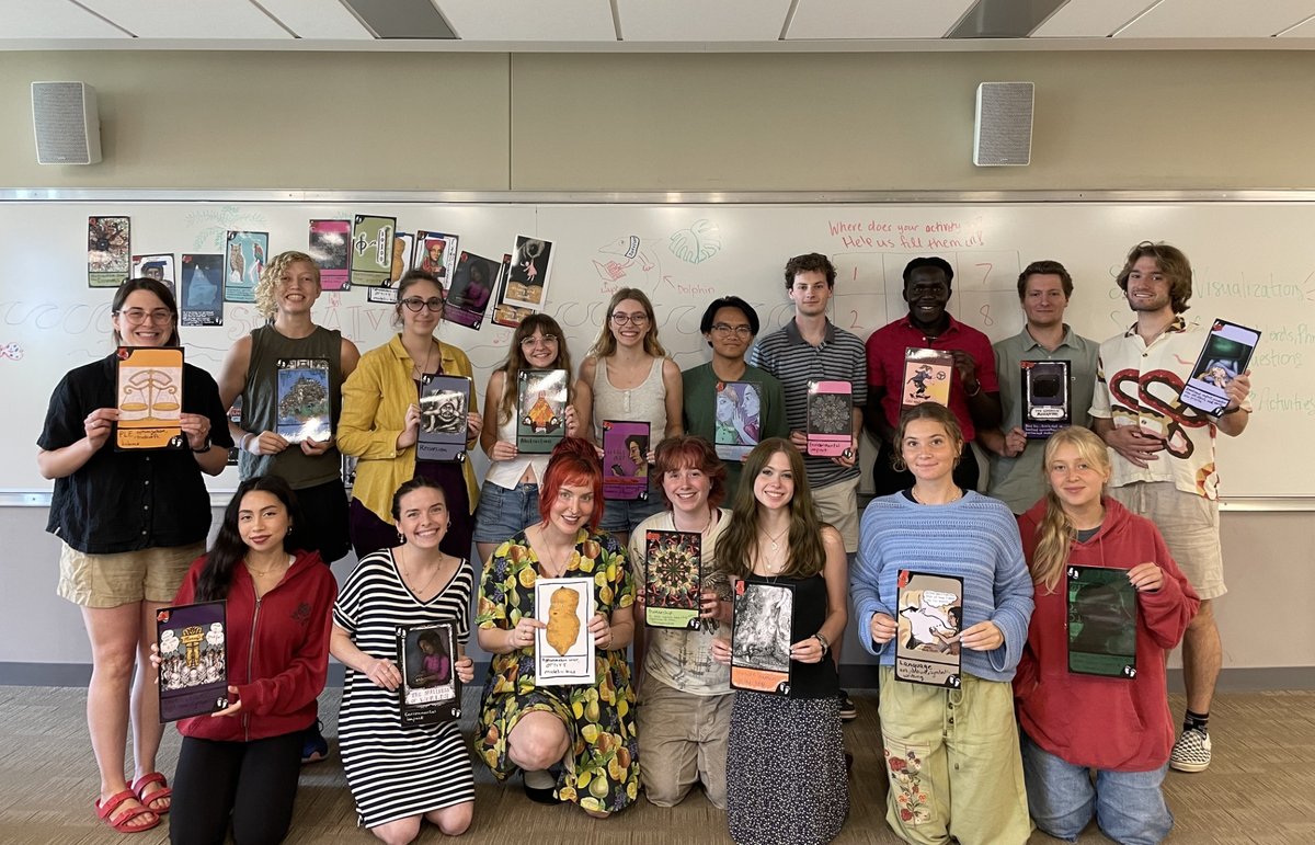 Vermont AI Literacy Initiative workshop: group of students holding illustrated concept cards they created.